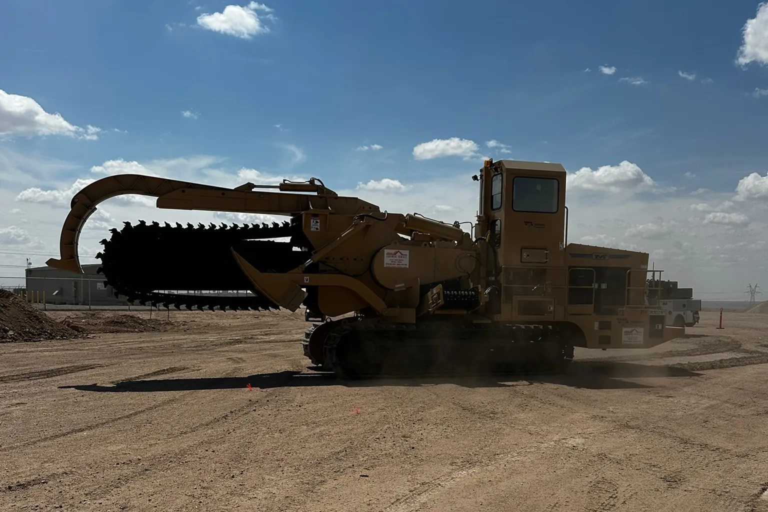 Ridge Rock Excavation chain trencher on a rock trenching job in West Texas